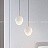 Серия подвесных светильников с разнотипными фигурными плафонами округлой формы из белого мрамора MIEL фото 7